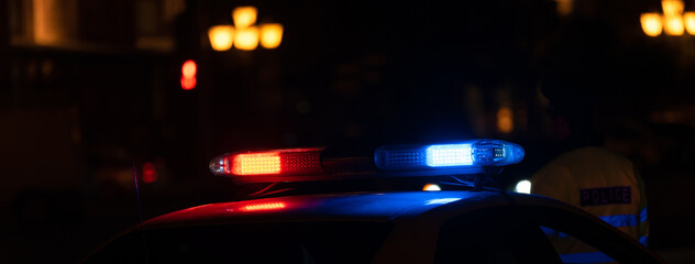 Police car with flashing lights on © Daniel