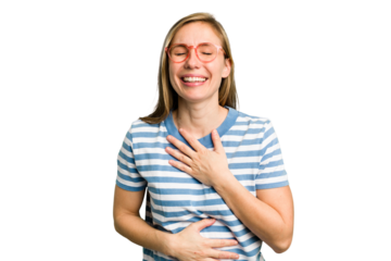 Young caucasian woman cutout isolated laughs happily and has fun keeping hands on stomach.
