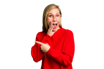 Young caucasian woman cutout isolated saying a gossip, pointing to side reporting something.