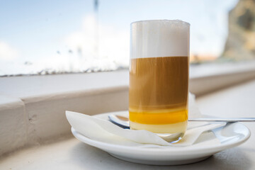 Three layers - coffee, milk and liqueur - makes delicious barraquito, specialty from Canary Islands