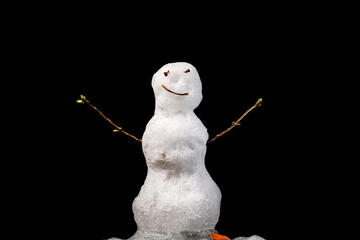 Melting Snowman on Black background. End of winter