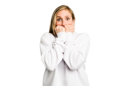 Young caucasian woman cutout isolated biting fingernails, nervous and very anxious.