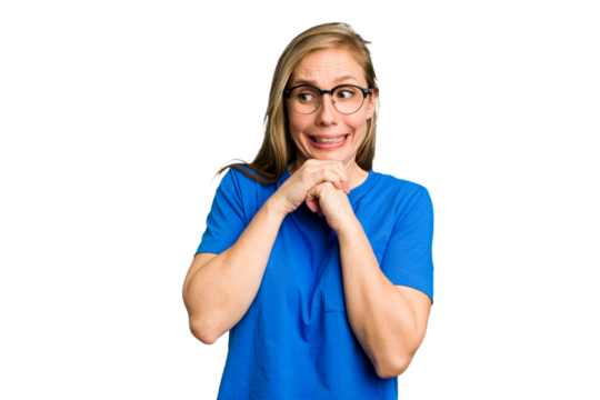 Young caucasian woman cutout isolated praying for luck, amazed and opening mouth looking to front.