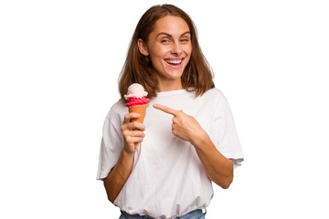 Young caucasian woman holding an ice cream isolated smiling and pointing aside, showing something at blank space.