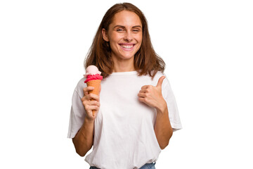 Young caucasian woman holding an ice cream isolated smiling and raising thumb up
