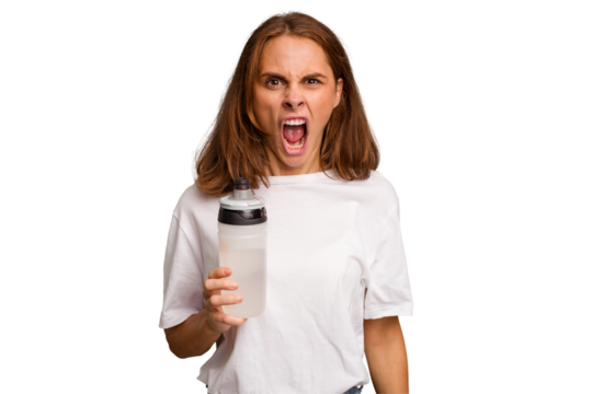 Young caucasian sport woman holding a bottle of water isolated screaming very angry and aggressive.
