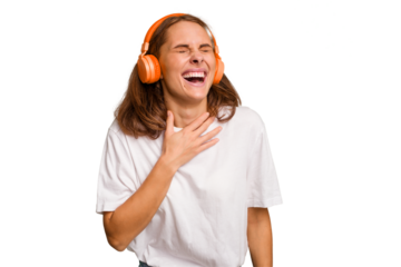 Young caucasian woman listening to music with headphones isolated laughs out loudly keeping hand on chest.