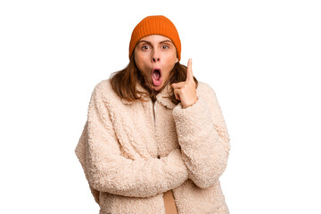 Young caucasian woman wearing winter clothes isolated having some great idea, concept of creativity.