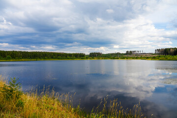 Hirschler pond near Clausthal-Zellerfeld in the Harz Mountains. Landscape with a small lake and idyllic nature.
