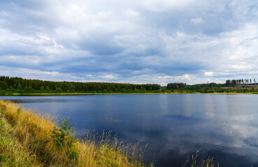 Hirschler pond near Clausthal-Zellerfeld in the Harz Mountains. Landscape with a small lake and idyllic nature. 