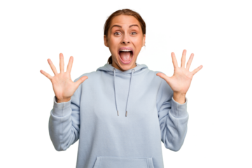 Young caucasian woman isolated receiving a pleasant surprise, excited and raising hands.