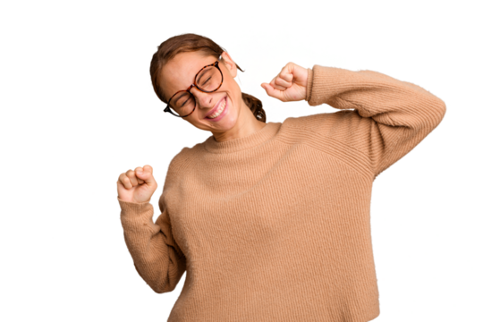 Young caucasian woman isolated celebrating a special day, jumps and raise arms with energy.