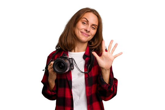 Young photographer caucasian woman isolated smiling cheerful showing number five with fingers.