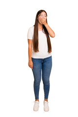 Young asian woman standing, full body cutout isolated thoughtful looking to a copy space covering mouth with hand.