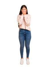 Young asian woman standing, full body cutout isolated covering mouth with hands looking worried.