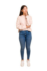 Young asian woman standing, full body cutout isolated contemplating, planning a strategy, thinking about the way of a business.