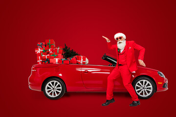 Full length body size view of attractive funny Santa dancing fooling near car having fun eve day...