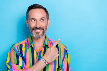 Photo portrait of funky mature businessman wear colorful striped shirt finger direct copyspace his...