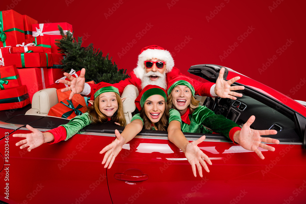 Poster portrait of four persons raise hands camera sitting inside auto prepare x-mas party service isolated