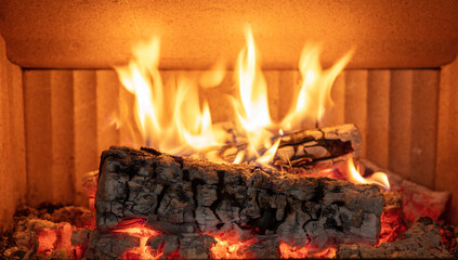 Fireplace close up, fire flame and burning wood log, warm home in winter