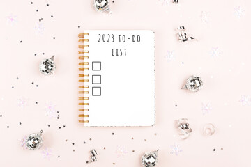 2023 year goals. A notepad with New Year resolutions and holiday decor. Plan, journal, to-do list....