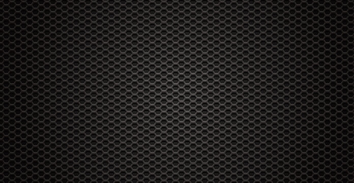 Black perforated metal background. Metal texture steel, carbon fiber background. Perforated sheet metal.