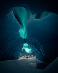 Person is standing in beautiful ice cave in Vatnajkull glacier Iceland in the winter