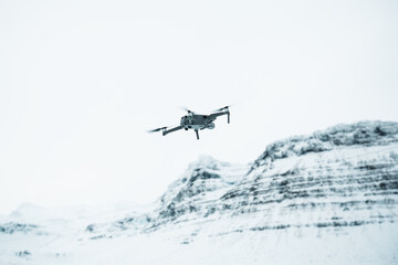 Fototapeta na wymiar Drone in flight during winter in Iceland, hills with snow