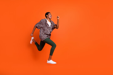 Fototapeta na wymiar Full body profile photo of crazy active person look empty space hurry rush isolated on orange color background