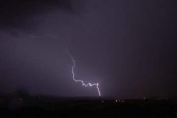 Storm lightning on the summer sky. Strong storm during summer. European landscape. 