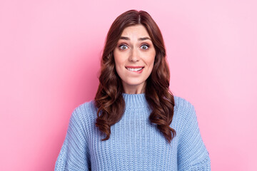 Obraz premium Closeup photo of young funny nervous woman wear knitted blue sweater wavy hair bite lips scared high price bills isolated on pink color background