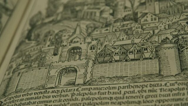 Medieval book, old Nuremberg chronicle with text and artwork of city walls and gate