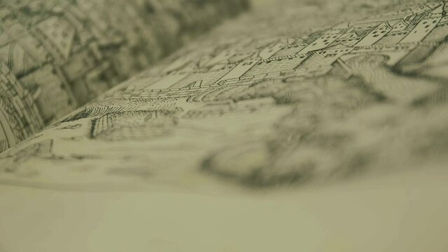 Close up detail of Medieval book, old Nuremberg chronicle with ink artwork of city, focusing
