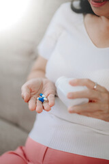 pills in a Senior's hands. Painful old age. Caring for the health of the elderly