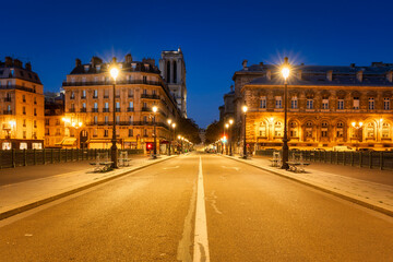 Fototapeta na wymiar Cityscape of Paris by the Seine river at down. France
