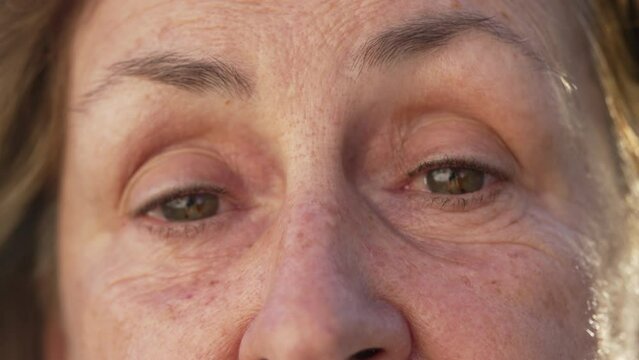 A Senior Woman Macro Close Up Of Face with Surprised Expression. Shock Emotion of a Female Older Woman Eyes SHOCK Reaction