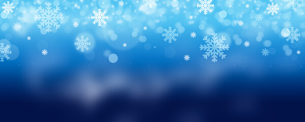 Abstract blue winter background with snow and snowflakes for christmas season.