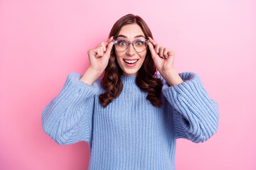 Portrait of excited good mood curly hair woman wear new eyeglasses good vision nice spectacles surprised cheap price isolated on pink color background