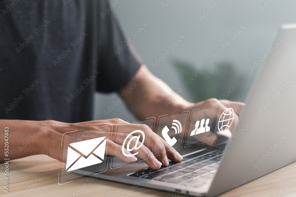 Poster businessman using laptop pc with contact icons on virtual screen. searching web, browsing informatio