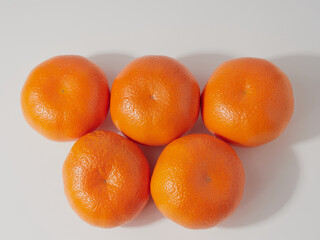 Ripe tangerines close-up on a white background.
