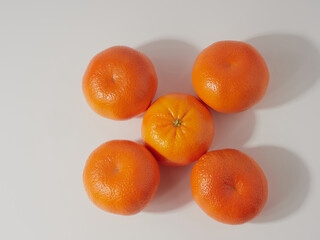 Ripe tangerines close-up on a white background.