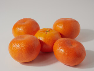 Ripe tangerines close-up on a white background.