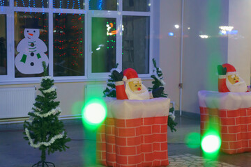 Decorative Santa Claus in the night city, selective focus. Background of preparation for Christmas and New Year holidays