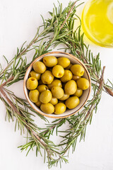 Olives with rosemary and olive oil. Top view