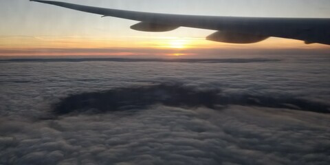 Fototapeta na wymiar Sunset over 30000 feet