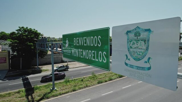 AERIAL - Road sign and highway traffic, Montemorelos, Nuevo León, Mexico, static