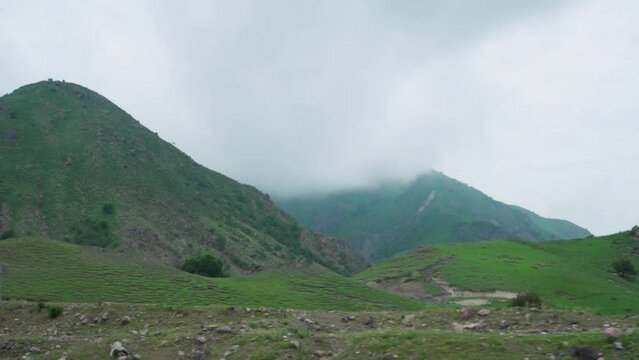 Clouds Above Mountains In Rural Khorgas, Xinjiang, China. wide