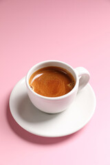 Obraz na płótnie Canvas White cup of coffee espresso isolated on pink background