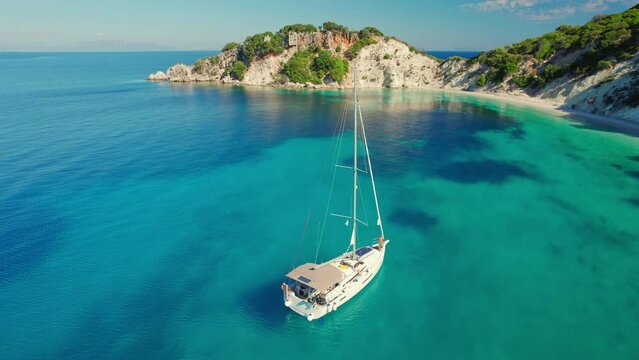 Aerial shot of yacht boat at Gidaki beach with turquoise sea in Itaca, Greece