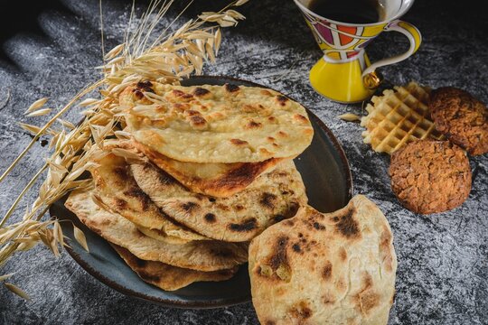 Dark background on the table. Exotic cuisine still life- indian food roti